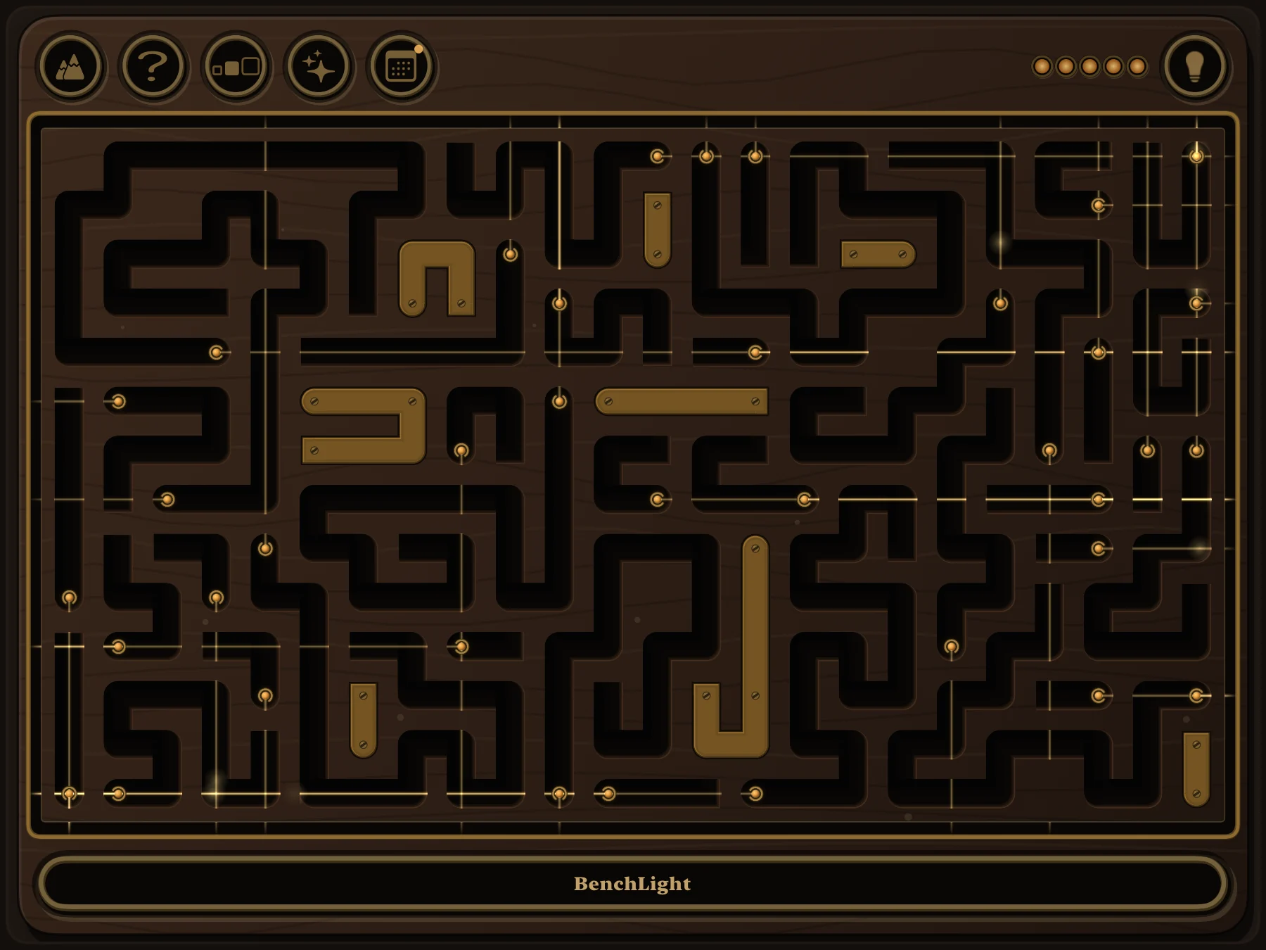A Medium BenchLight board partway done, thin lines of light running from the empty slots out to the edge