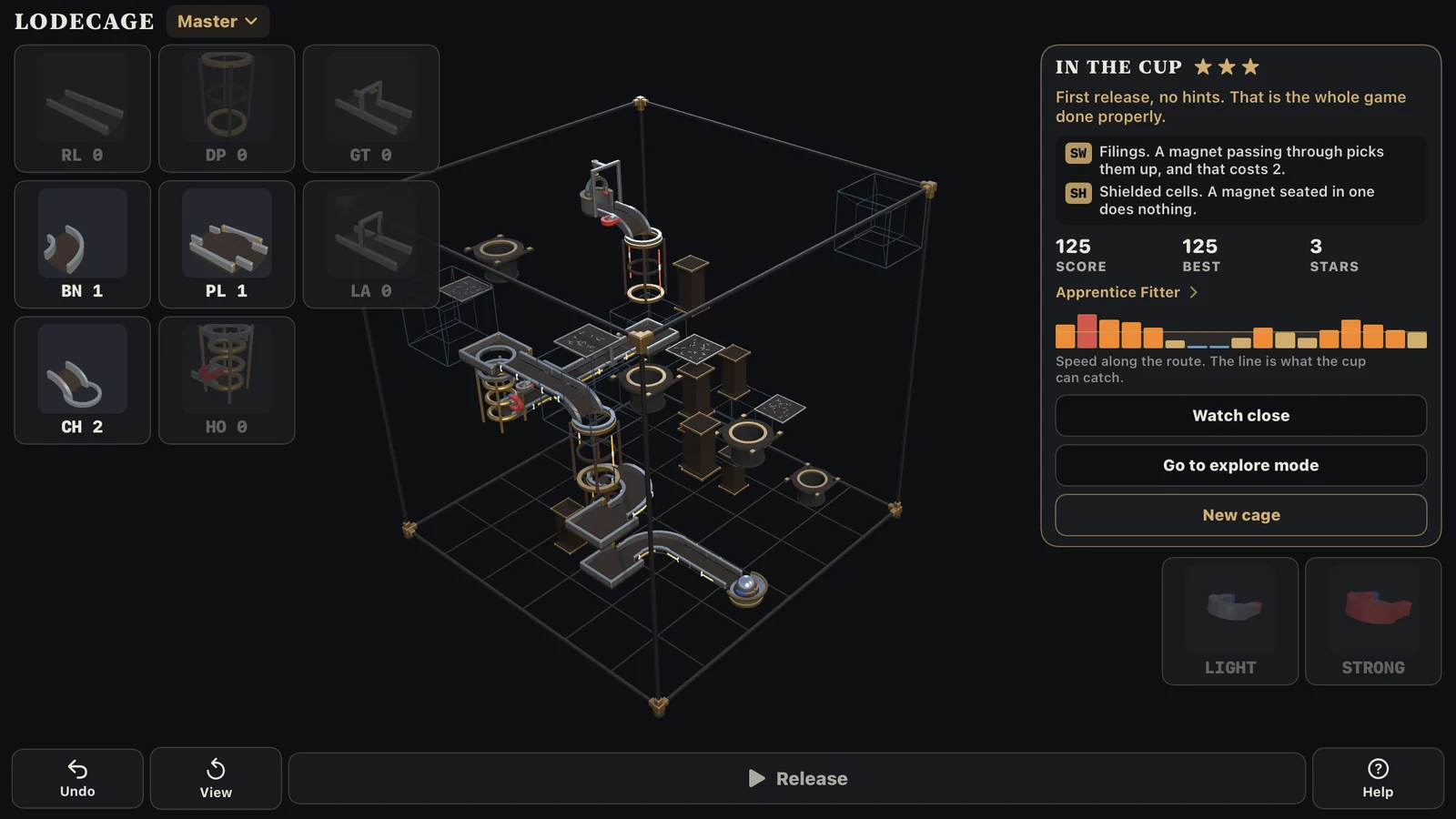The LodeCage screen on a Master cage after a solve: the whole cage in its frame, the ball held in the cup, and the card reading In the cup