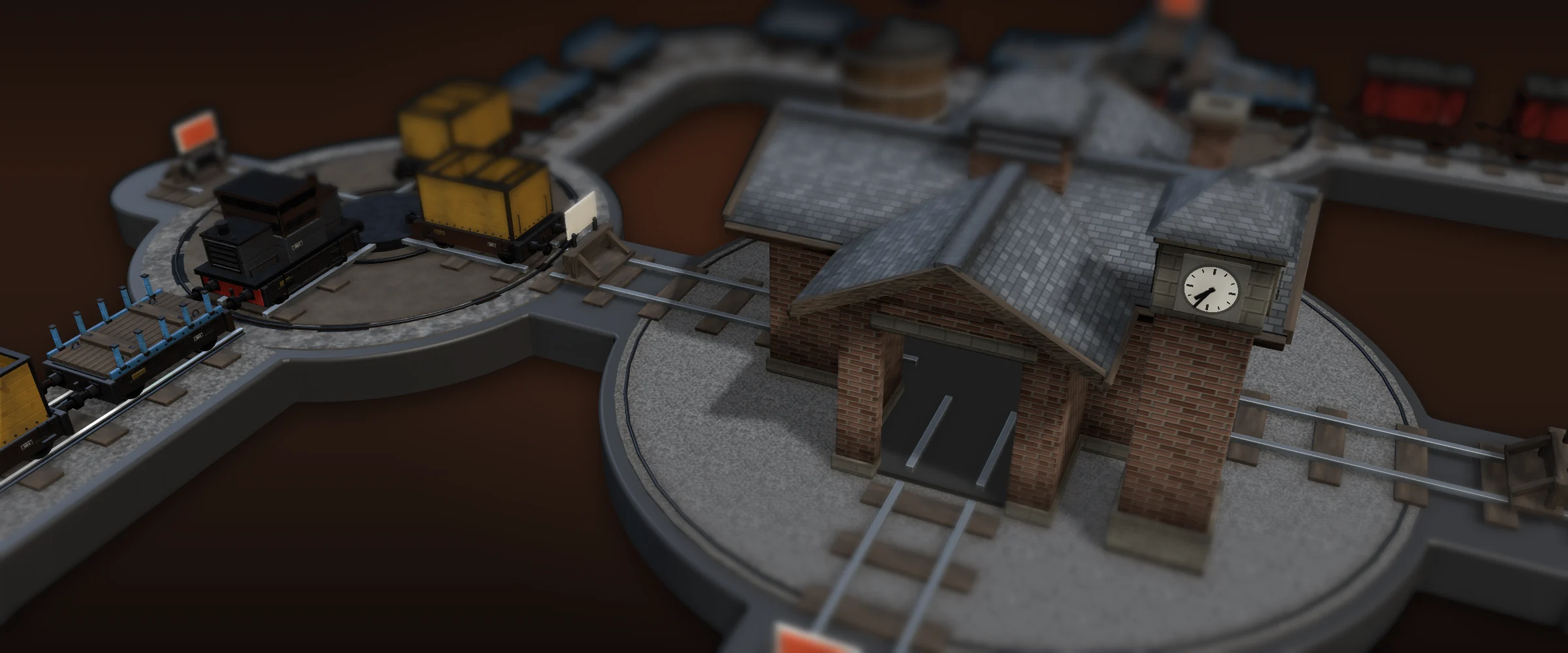 The TurnRake yard at the works building — brick and slate under a clock tower, with rakes of wagons standing on the loop beyond